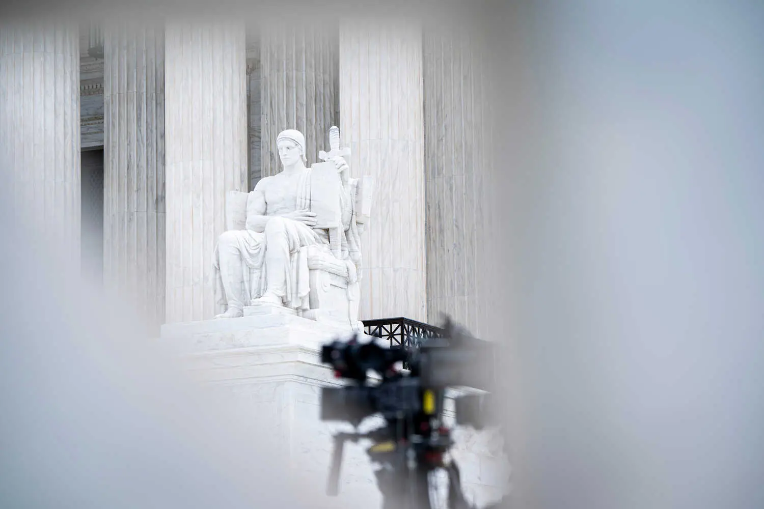 The Supreme Court seen in the background. There is a broadcasting camera set up in the foreground.